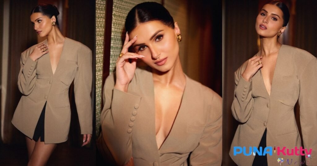 Fans give Tara Sutaria a thumbs up as she wears an oversized blazer and a little skirt to a glitzy event